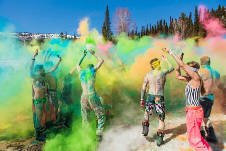 Sheregesh, Kemerovo region, Russia - April 13, 2019: A group of a young people throwing colorful holi powder.のeditorial素材
