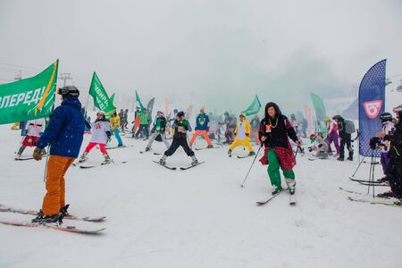 Sheregesh, Kemerovo region, Russia - April 06, 2019: Young people in carnival costumes on the mountain slope.のeditorial素材