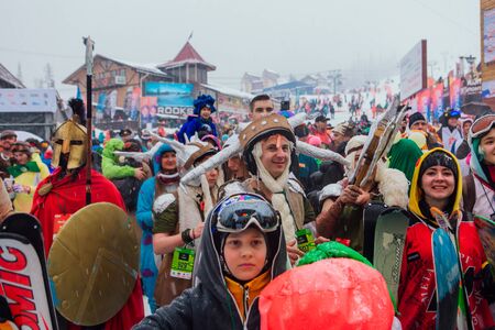 Sheregesh, Kemerovo region, Russia - April 06, 2019: Young people in carnival costumes on the mountain slope.のeditorial素材