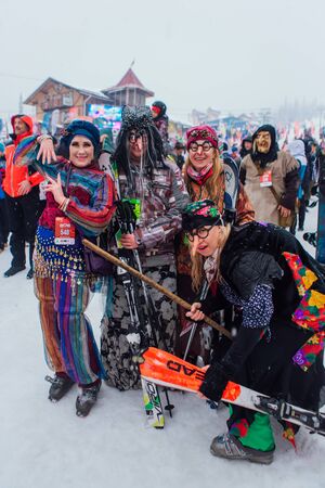 Sheregesh, Kemerovo region, Russia - April 06, 2019: Grelka Fest is a sports and entertainment activity for ski and snowboard riders in carnival costume. Young people in carnival costumes.のeditorial素材