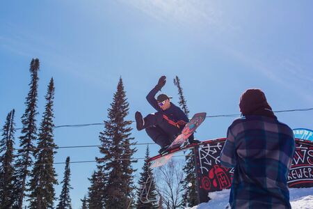 Sheregesh, Kemerovo region, Russia - April 10, 2019: Jaws Slash Camp is a snowboard and mountain ski competition where riders doing extreme tricksのeditorial素材