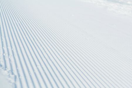 Snow lines made from a snow machine on a ski slope, textureの写真素材