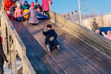 Novokuznetsk, Russia- January 07, 2019: Russian winter entertainment: children having fun...