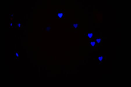 Colorful abstract heart shape blured bokeh at night timeの写真素材