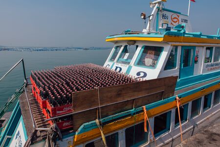 Sriracha, Chonburi, Thailand - February 15, 2018 : Glass bottles of Coca Cola in boxes on ferry deck going to Koh Sichang. Coca Cola Company is leading soda drinks manufacturer in the world.のeditorial素材