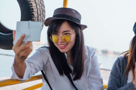 Sriracha, Chonburi, Thailand - February 15, 2018: Tourists traveling on a ferry to the Koh Sichang...