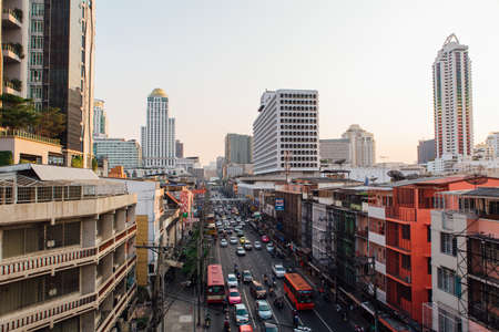 Bangkok, Thailand - February 13, 2018: Traffic moves slowly along a busy road of Bangkok, Thailand. Cars, motobikes and city transport on the road.のeditorial素材