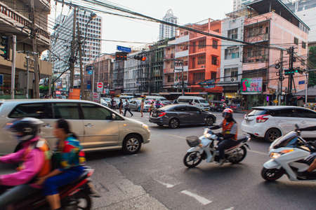 Bangkok, Thailand - February 13, 2018: Traffic moves slowly along a busy road of Bangkok, Thailand....