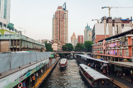 BANGKOK, THAILAND - FEBRUARY 13, 2018: River bus in Bangkok. Public transport service boats at canals. The view from the bridge.のeditorial素材