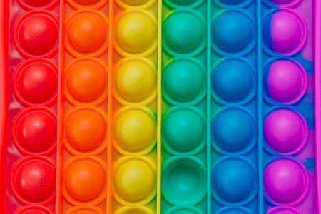Colorful antistress pop it toy close up.