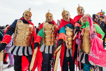 Sheregesh, Kemerovo region, Russia - April 03, 2021: Grelka Fest is a sports and entertainment activity for ski and snowboard riders in carnival costume. Young people in costumes of gladiators.のeditorial素材