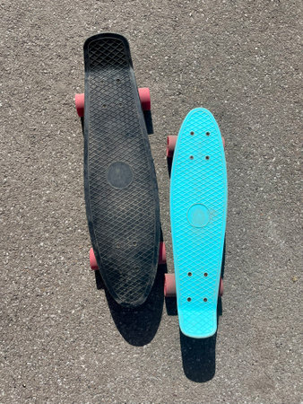 Two plastic skateboards on the ground. Top view.の写真素材