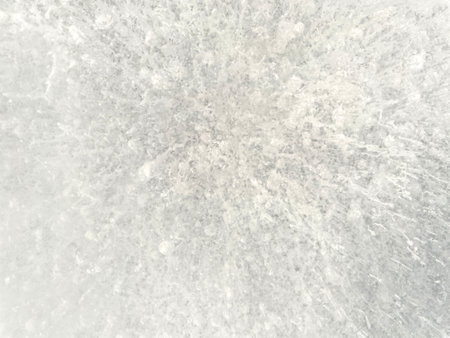 Ice texture background. Textured cold frosty surface of ice block with frozen air bubbles.の写真素材
