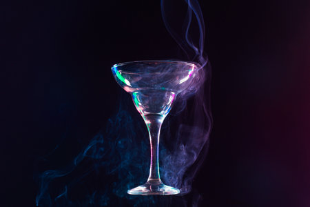 levitating wine glass full of smoke on a black backgroundの写真素材