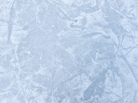 Ice background with marks from skating and hockey. Ice hockey rink scratches surfaceの写真素材