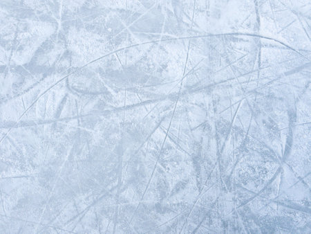 Ice background with marks from skating and hockey. Ice hockey rink scratches surfaceの写真素材
