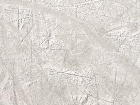 Ice background with marks from skating and hockey. Ice hockey rink scratches surfaceの写真素材