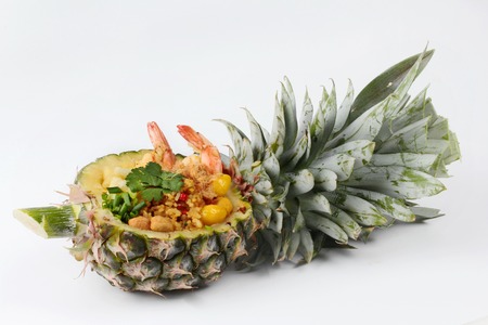 Fried rice with shrimp ,pineapple and ginkgo in pineapple on selective focus.の写真素材