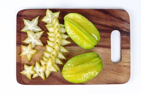 Star apples on wood,white background.の写真素材