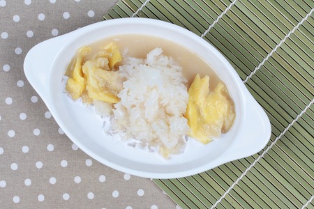 Durian in coconut cream with Thai sticky rice  topped coconut milk. Top view.の写真素材