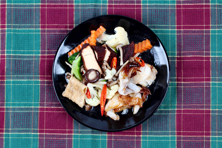 Fried big noodle topped mixed vegetables and side dish for organic food.の写真素材