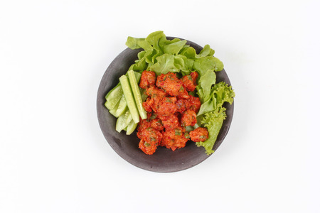 Thai food,Deep fired curried fish cake with lentils served with side dish as cucumber ,red chili and red onion in sour sauce. (Tod Mun Pla Krai) is popular Thai dessert.の写真素材