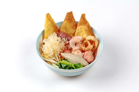 Thai noodle with pink tofu soup topped rugby fishball,wonton,porkball,boiled porkblood,pork...