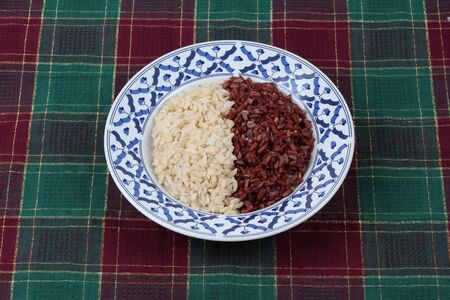 Ready served of brown rice ,milled rice imperfectly cleaned and organic red brown jasmine (Manpoo) rice ,Popular Thai organice  for health care.の写真素材