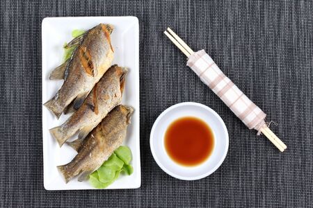 Thai food , Deep fried small snapper with bean sauce.の写真素材