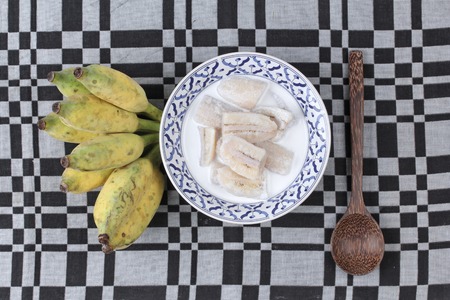 Thai dessert , Ready served of cultivated banana in coconut milk and wholes of banana.の写真素材