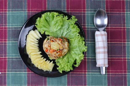 Thai cuisine , Fried organic red brown jasmine rice with pineapple in yellow curry powder call Khao Pad Subparod in Thai.の写真素材