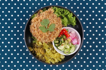 Crispy canned tuna  with sliced pickle lettuce and green oak served with Thai cucumber chili sauce ( Ar Jad in Thai) の写真素材