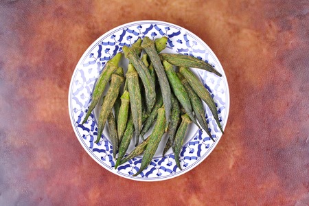 Thai Organic snack for health ,Crispy Okra dried seasoning in Thai pattern dish.の写真素材