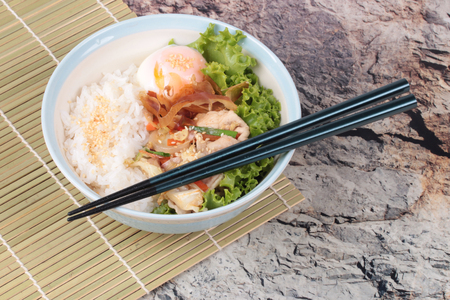 Japanese cuisine , Rice with soft boil eggs and fried pork topped white sesame and slicrd dried mackarel in Japanese style call as Oyakodon.の写真素材