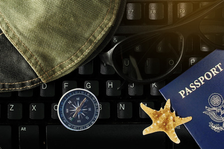 Time for relaxation and tourism,Keep keyboard to traveling ,Overhead view of Traveler's accessories and keyboard,Time of award of work, Essential vacation items, Travel concept background.の写真素材