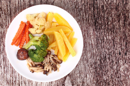 Food for health, Fried sliced potato and Shimeji mushroom with mixed vegetables. No meat recipe.の写真素材