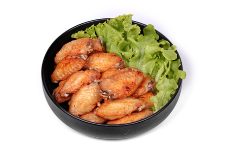 Ready served ,Deep fried chicken wings topped green oak.の写真素材