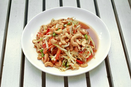 Thai popular food call Som Tum in Thai ,Spicy and sour mixed vegetable salad with papaya roll .の写真素材