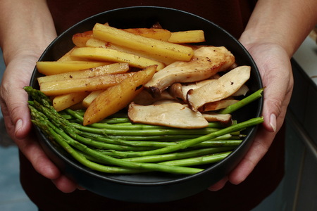 Side dish of steak with sliced carrot ,potato ,corn ,broccoli and cauliflower.の写真素材
