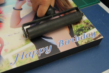 Photo Floating frame building in canvas art ,Hand Rubber Roller to be rolling Photo paper on board...