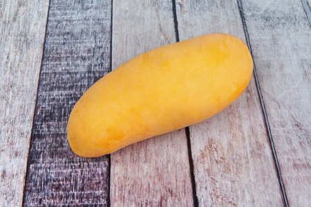 Thai popular fruit,Ripe golden ,Mahachanok Mango on woodの写真素材