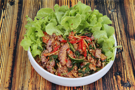 Popular Thai seafood.Fried spicy basil with Mantis shrimps topped green oak lettuce .
の写真素材