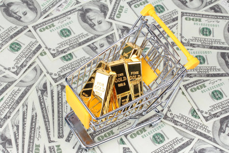 6 Gold bars 1 kg, in shopping  trolley with yellow mark for supermarket paced on bank note.の写真素材