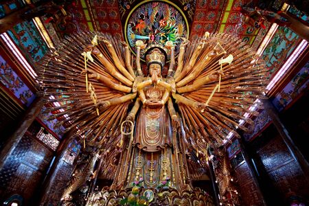 large Guan Yin Bodhisattva carved from wood 12 meters high in Wat Metta Photiyan, A Buddhist temple in Chinese style in Thailand.のeditorial素材