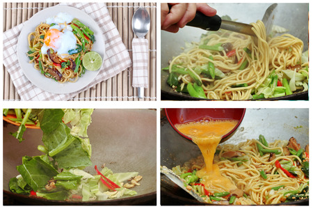 Homemade cooking of fried sour sweet Chinese noodle with soft-boiled egg and green lemon.の写真素材