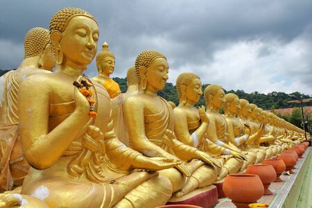 Buddha statue sitting   image of 1250 monks chant around the Buddha image at  Phuttha Utthayan Makha Bucha Anusornのeditorial素材