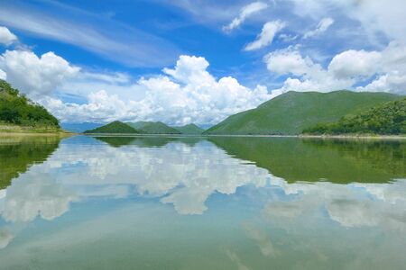 Beautiful view,The Islands and mountains on lake in dam. On the day of clouds and cloud reflection in the beautiful reservior of  KaengKrachan National Park,Thailand.の写真素材