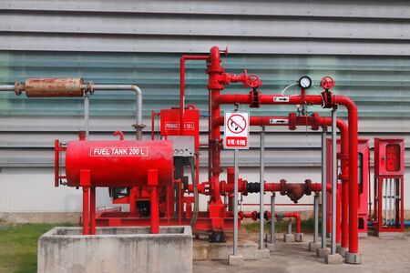Fire water fighting system as Desiel pump and red water pipe system installed outside of industrial area.の写真素材