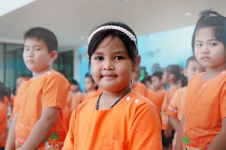 Samutprakarn,Thailand ,23 Nov 2018, Young children dressed in orange patterned fun and enjoy with the primary school activiries.のeditorial素材