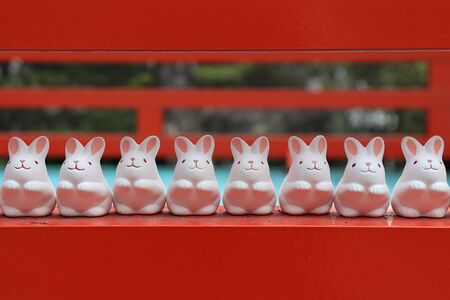 Lovely little white rabbit statue was placed in front of an outdoor Higashi Tenno Okazaki shrine, Kyoto,Japanの写真素材